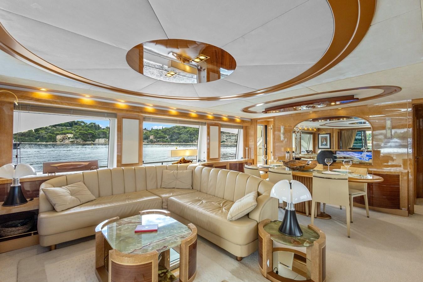 a living room with a couch and a table aboard DEBRA ONE Yacht for Sale