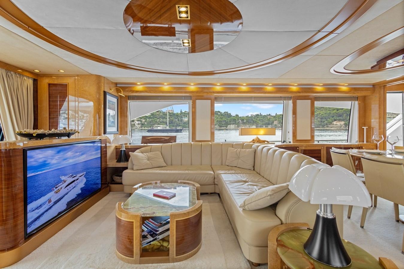 a living room with a large screen aboard DEBRA ONE Yacht for Sale