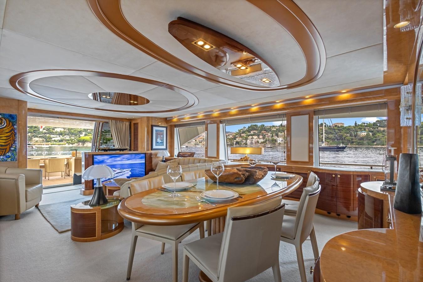 a large dining room with a large open window aboard DEBRA ONE Yacht for Sale