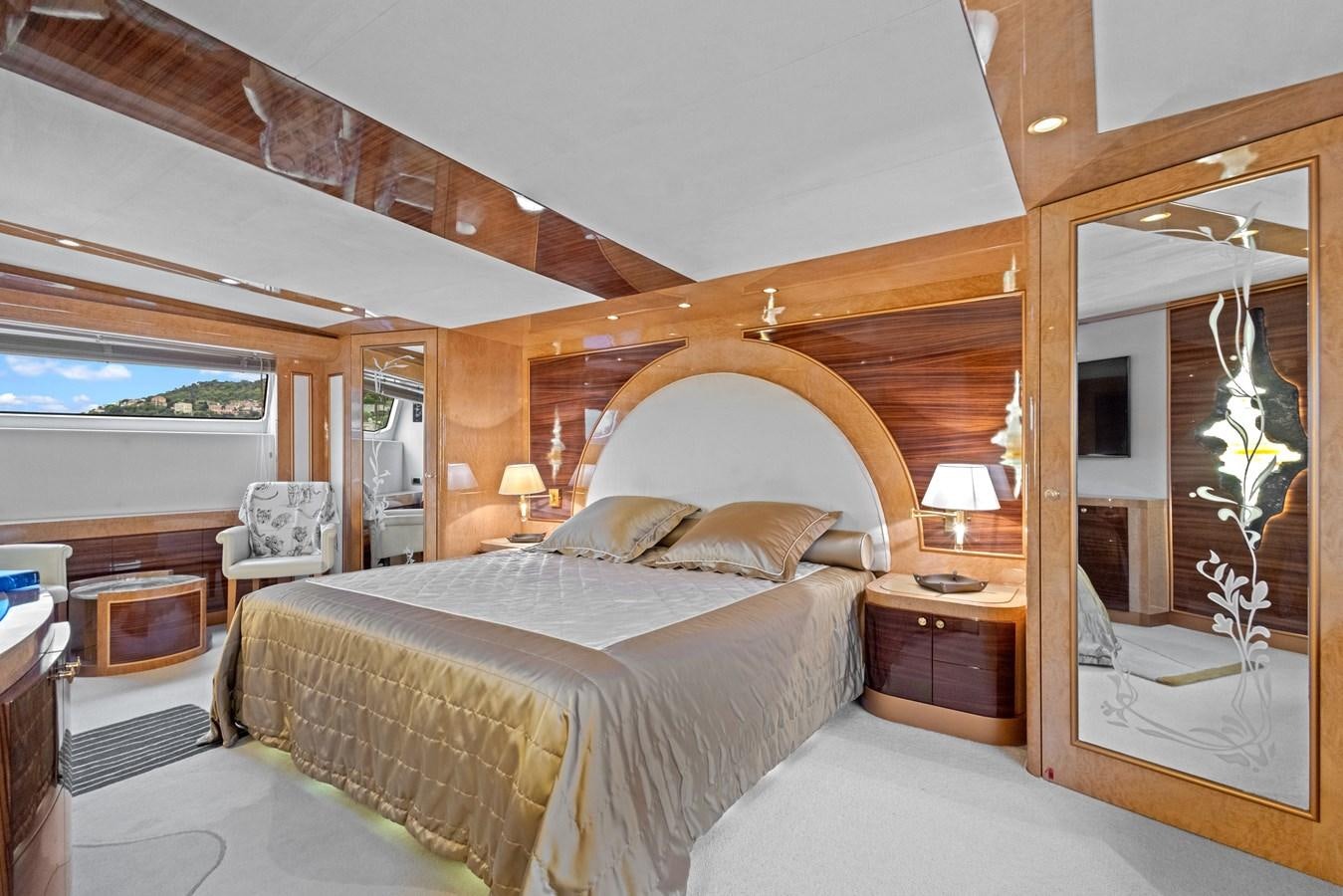 a bedroom with a large mirror aboard DEBRA ONE Yacht for Sale