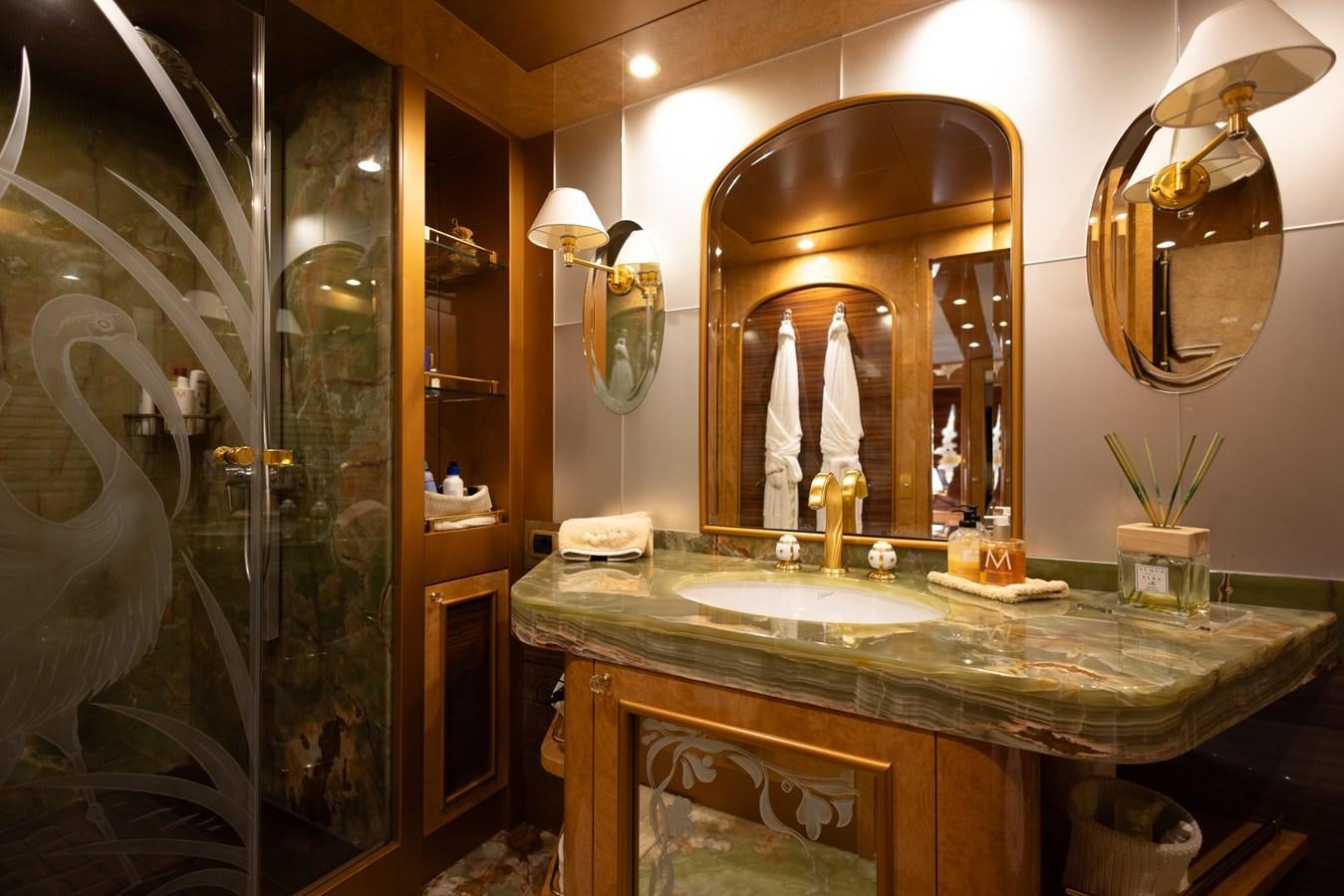 a bathroom with a large mirror aboard DEBRA ONE Yacht for Sale