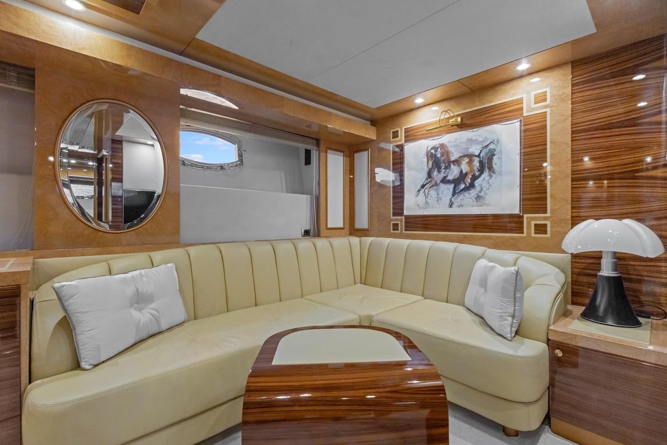 a couch and a table in a room aboard DEBRA ONE Yacht for Sale
