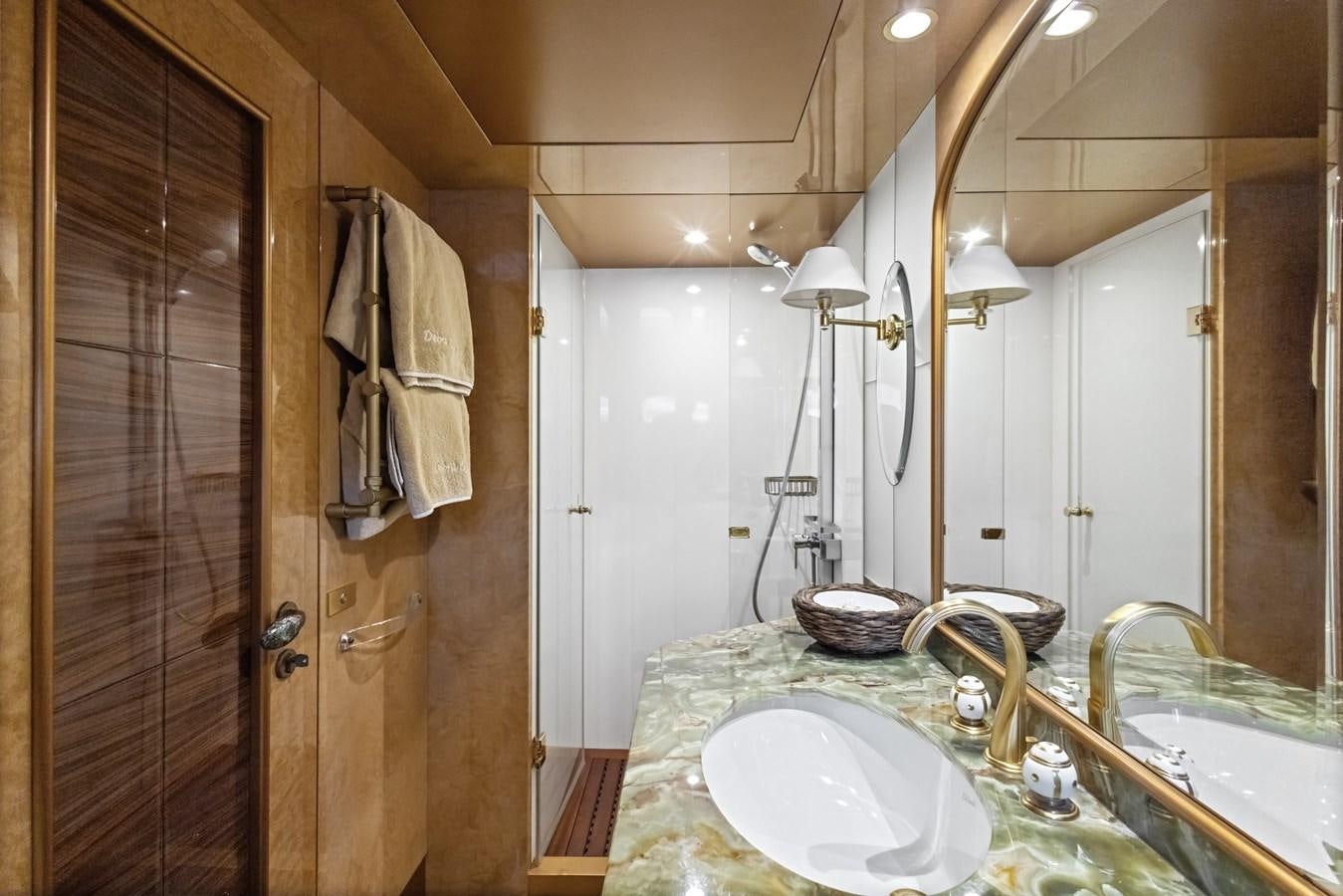 a bathroom with a sink and a mirror aboard DEBRA ONE Yacht for Sale