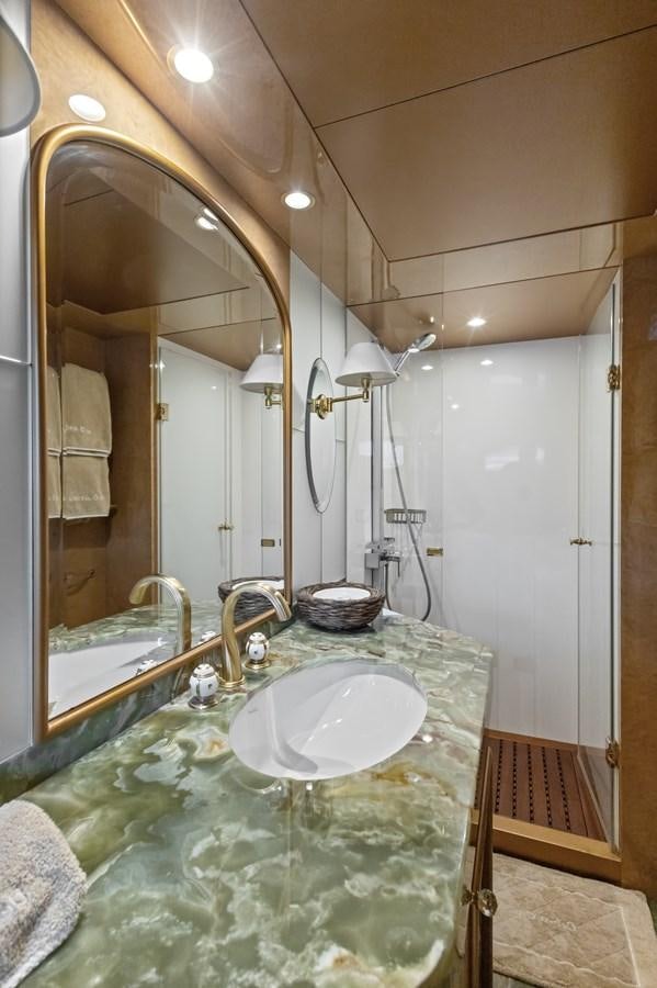 a bathroom with a large mirror aboard DEBRA ONE Yacht for Sale