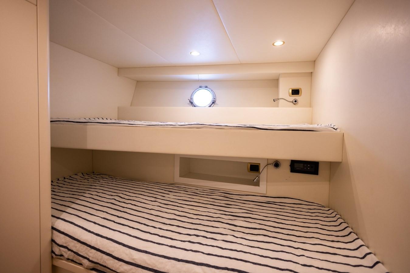 a large room with a bed aboard DEBRA ONE Yacht for Sale