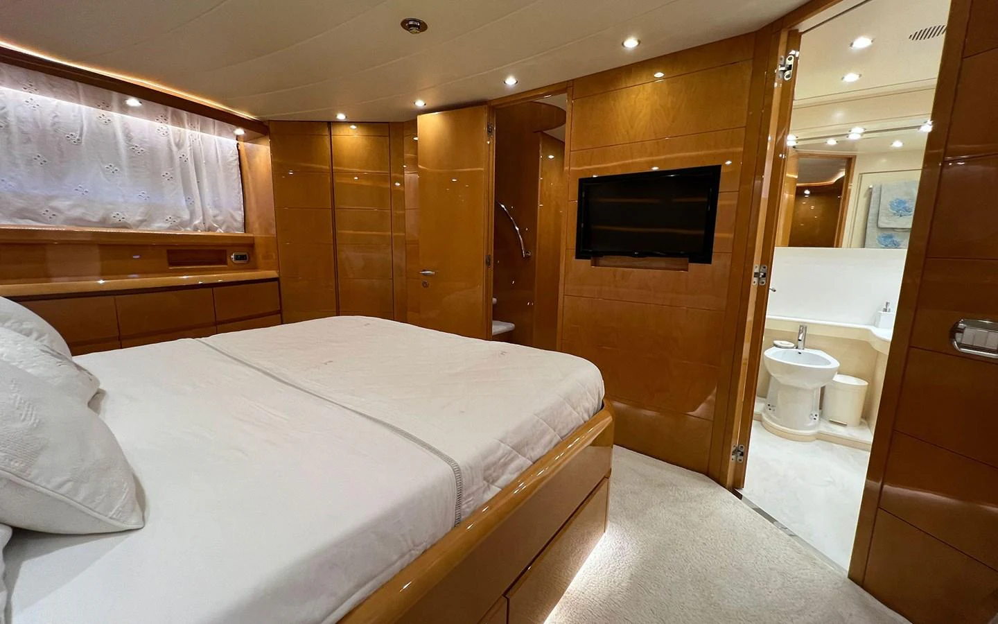 a bathroom with a bed and a mirror aboard WILLFUL Yacht for Sale