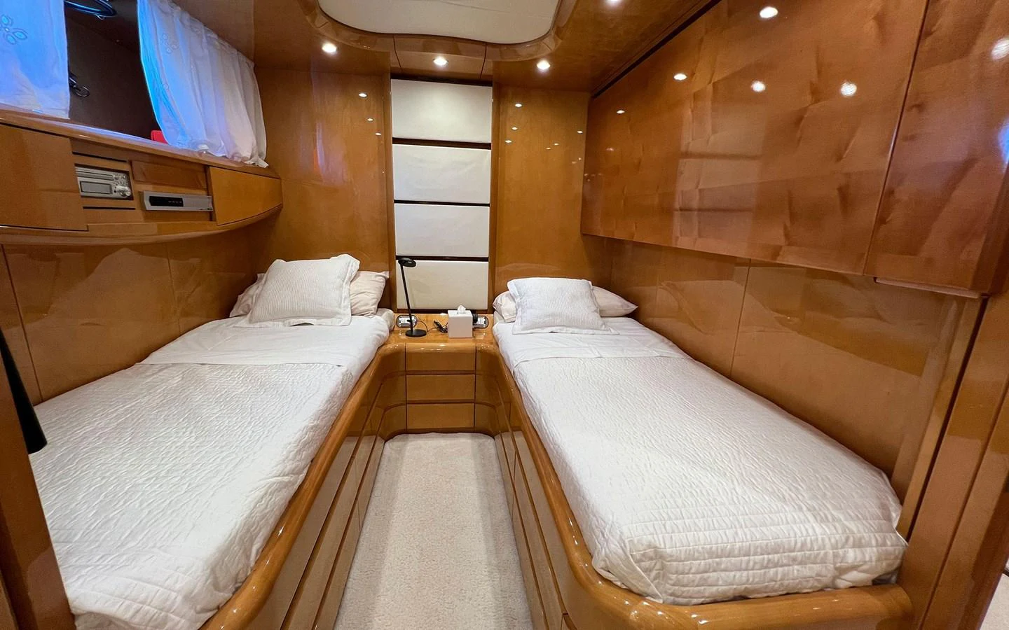 a room with beds and a wood wall aboard WILLFUL Yacht for Sale