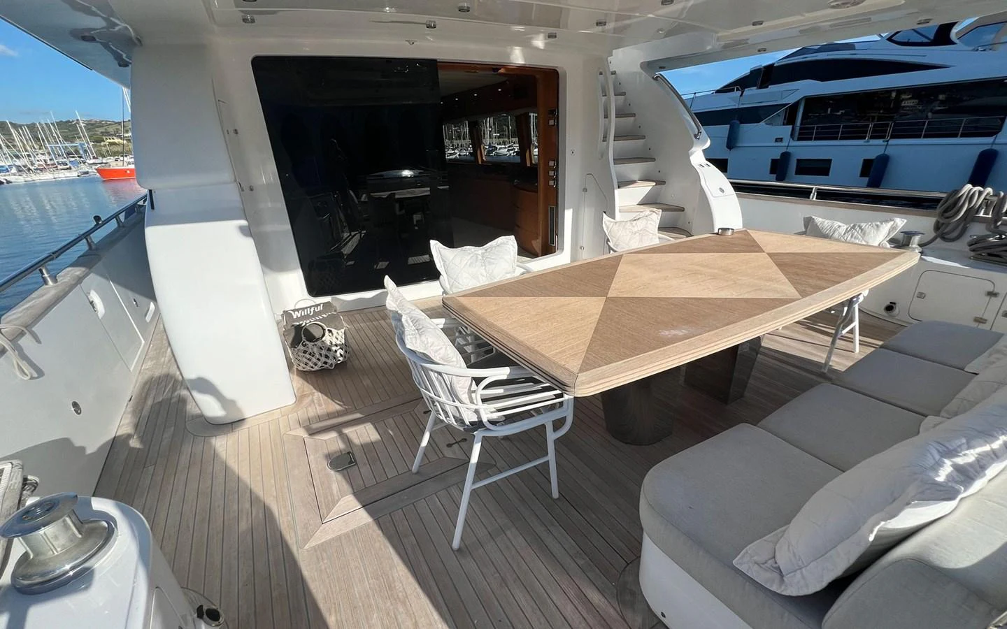 a room with a table and chairs aboard WILLFUL Yacht for Sale
