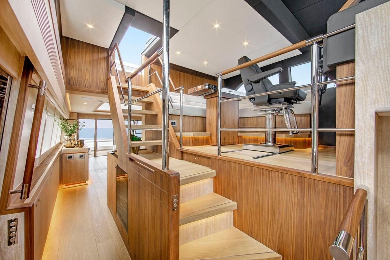 a room with wooden floors and a staircase aboard HELGA Yacht for Sale