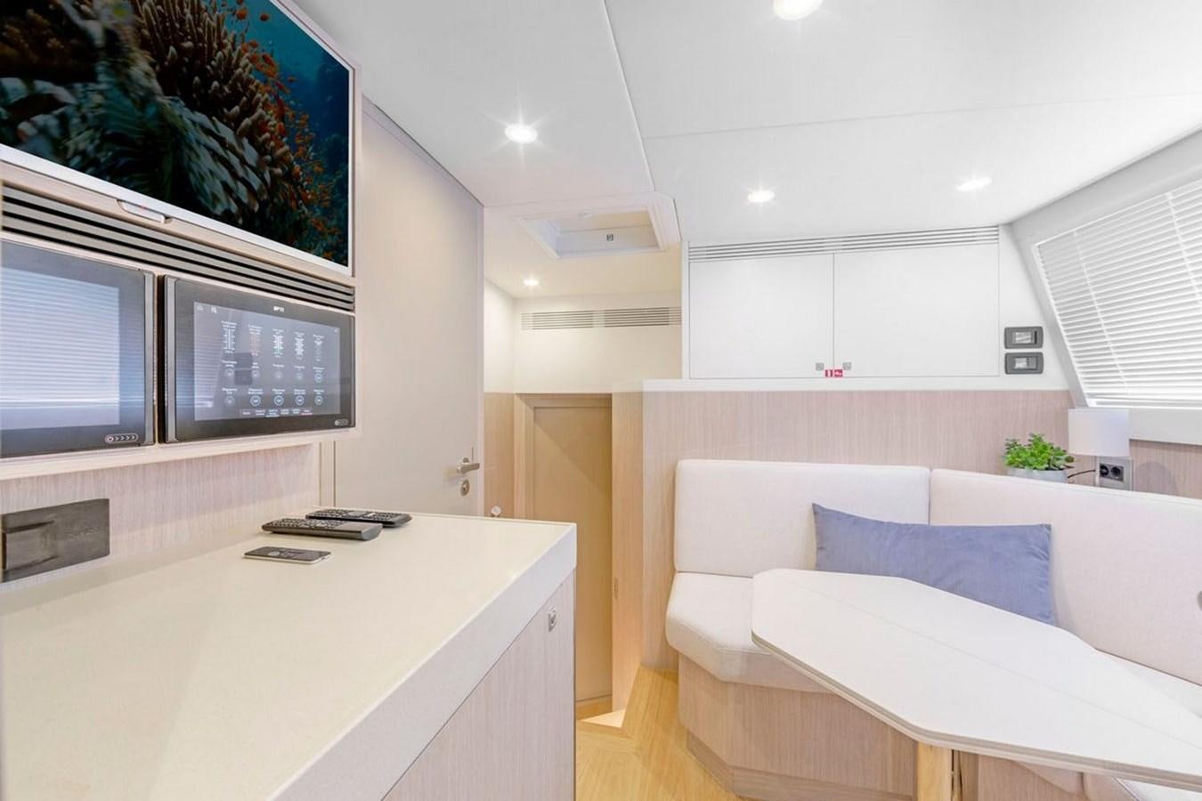 a room with a bed and a tv aboard HELGA Yacht for Sale