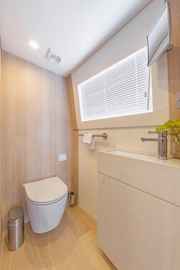 a bathroom with a toilet and sink aboard HELGA Yacht for Sale
