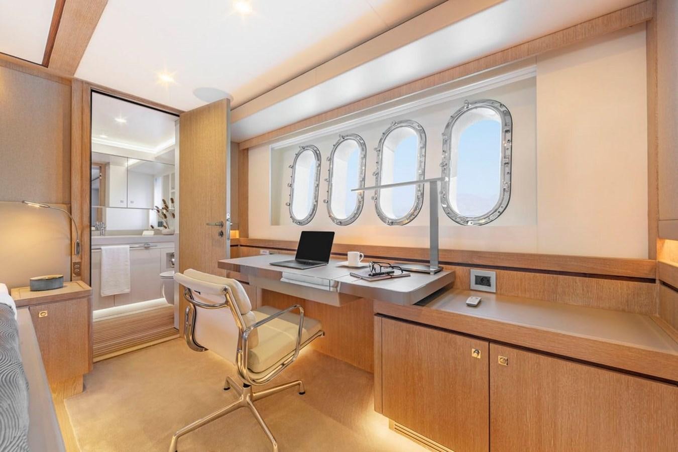 a room with a desk and a computer aboard HELGA Yacht for Sale