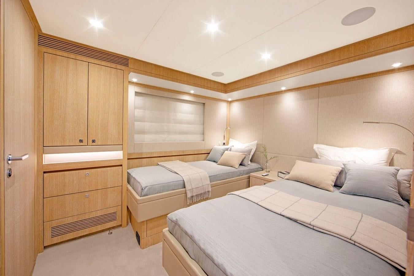 a room with two beds aboard HELGA Yacht for Sale