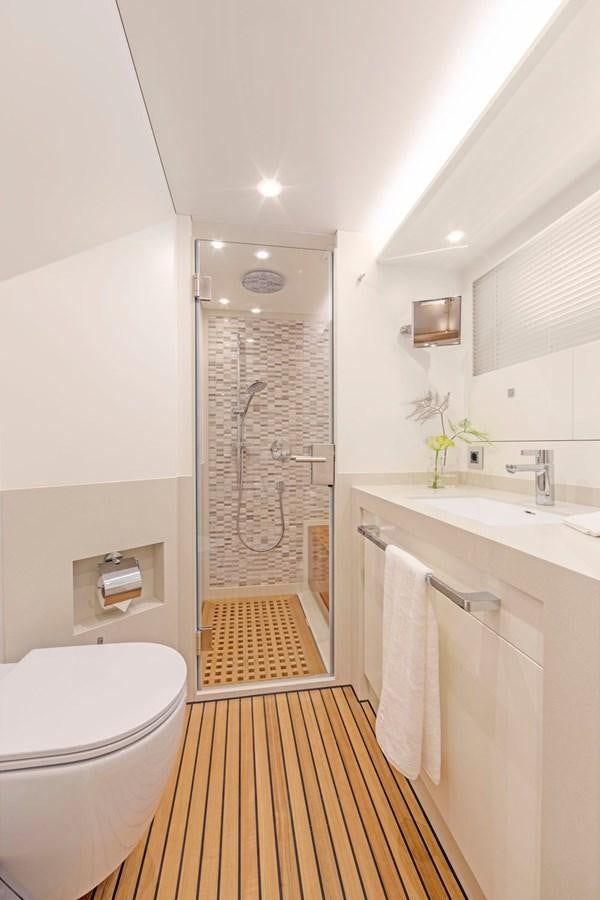 a bathroom with a shower and sink aboard HELGA Yacht for Sale