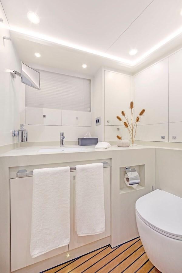 a bathroom with a white countertop aboard HELGA Yacht for Sale