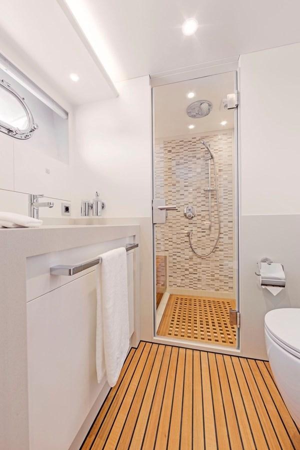 a bathroom with a shower unit aboard HELGA Yacht for Sale