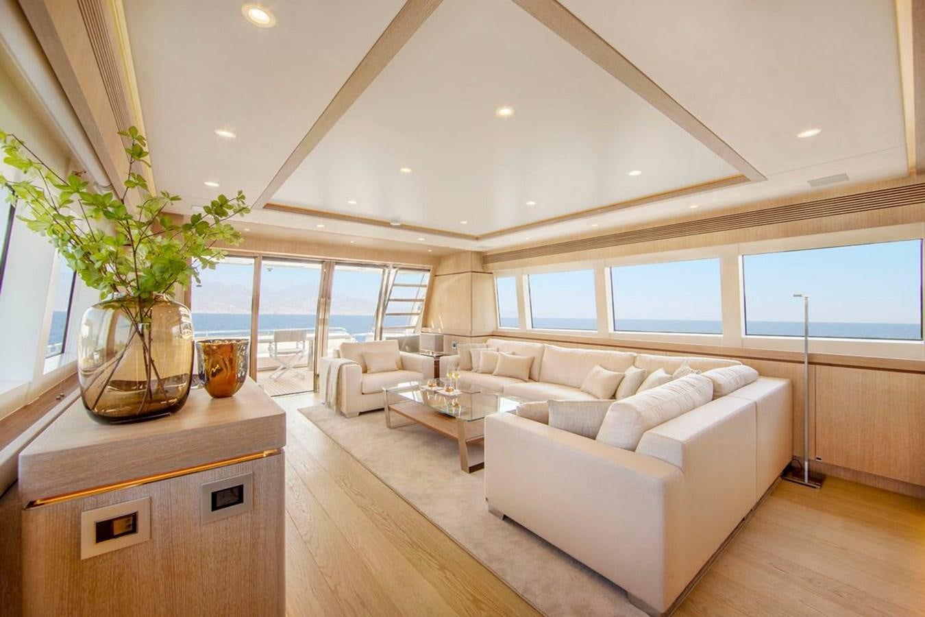 a living room with a large window aboard HELGA Yacht for Sale