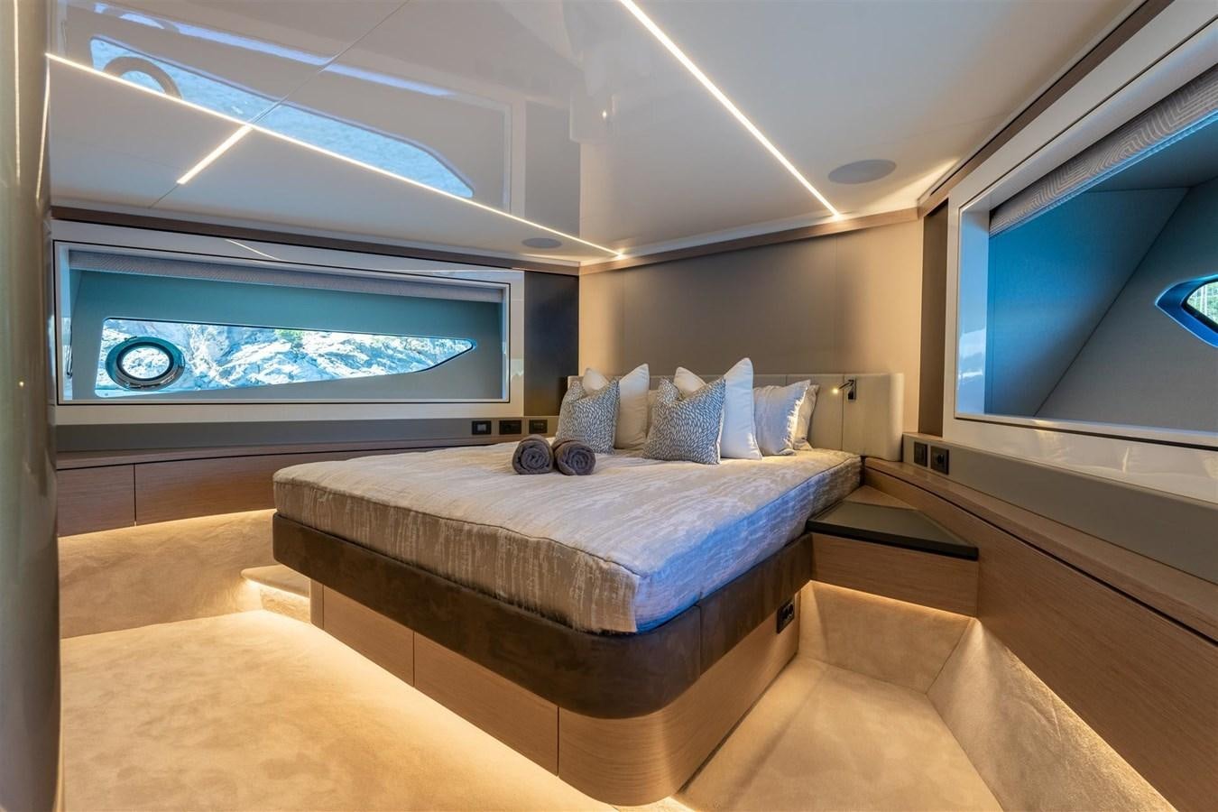a large bed in a room aboard OCEAN 182 Yacht for Sale