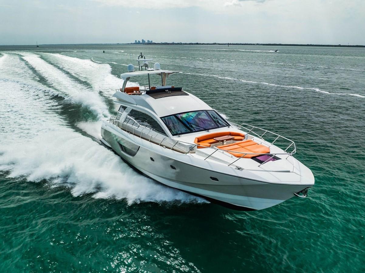 a white boat on the water aboard KNOT GUILTY Yacht for Sale