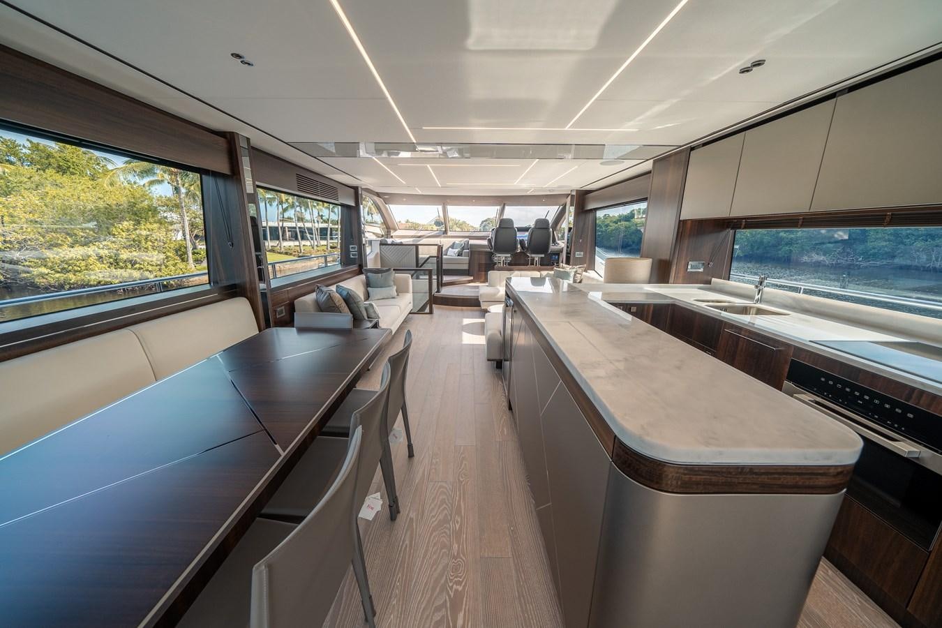 inside of a vehicle with a large table and chairs and a large window aboard 88 YACHT Yacht for Sale