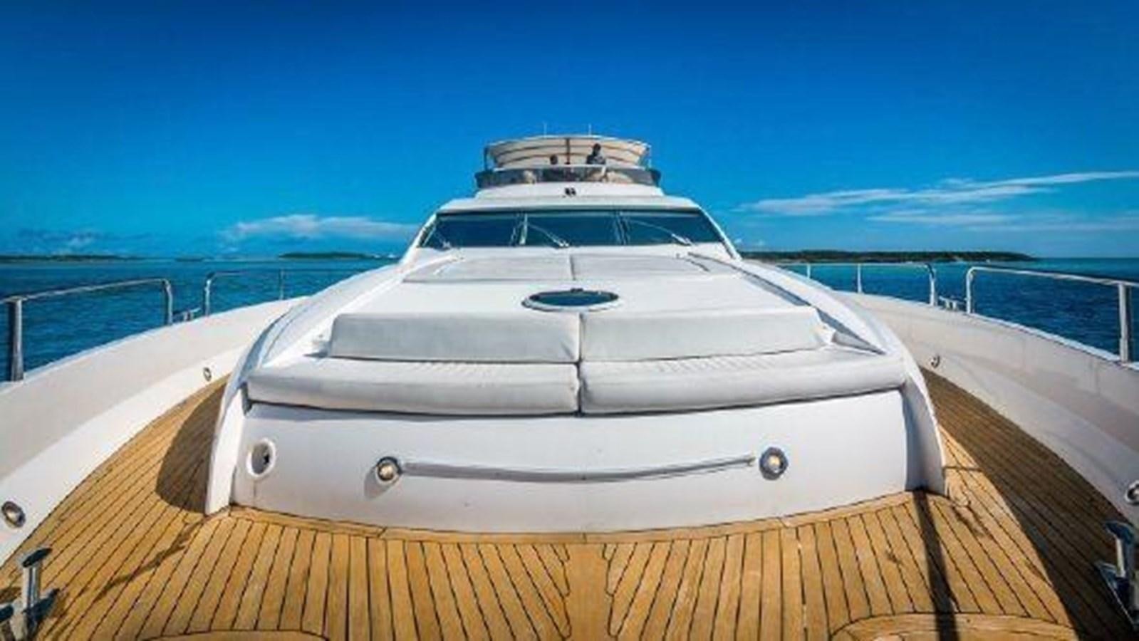 a white boat on a wooden dock aboard ACQUA ALBERTI Yacht for Sale