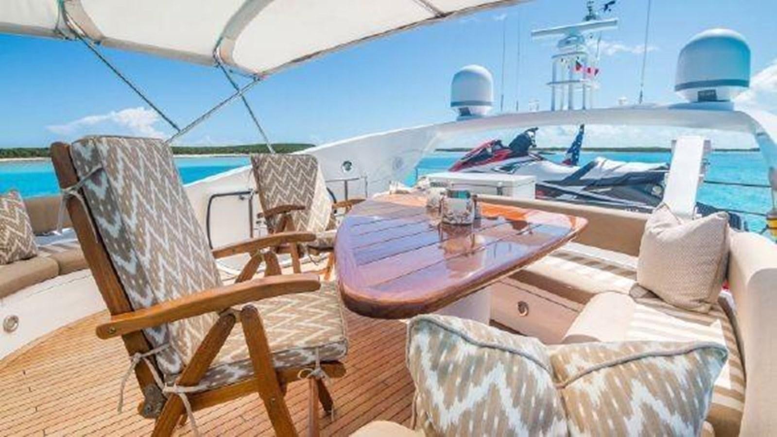 a boat with a table and chairs aboard ACQUA ALBERTI Yacht for Sale