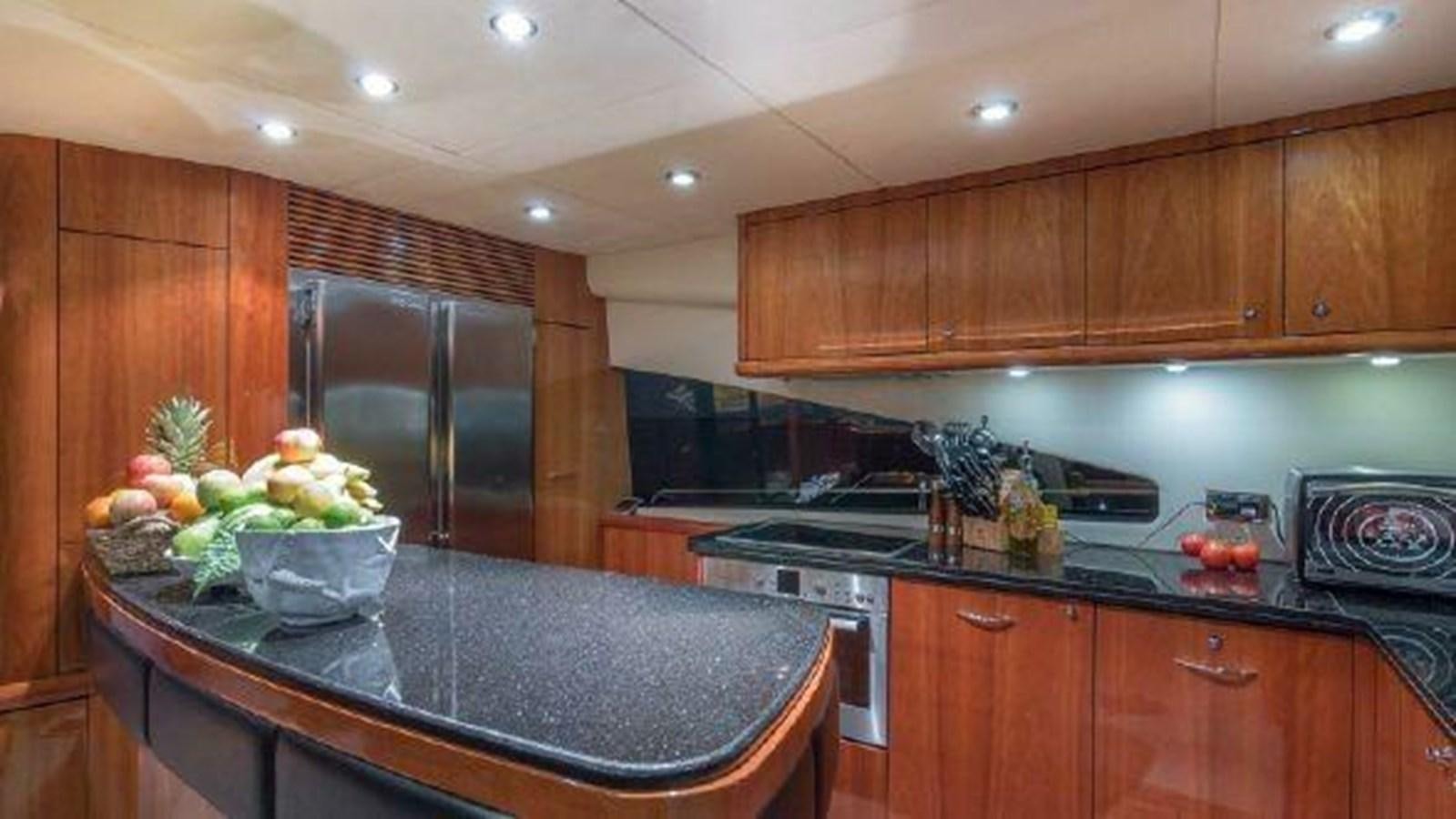 a kitchen with wooden cabinets aboard ACQUA ALBERTI Yacht for Sale