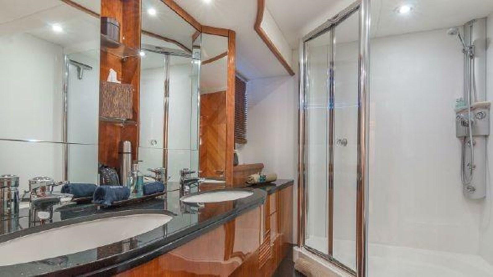 a bathroom with a large mirror aboard ACQUA ALBERTI Yacht for Sale