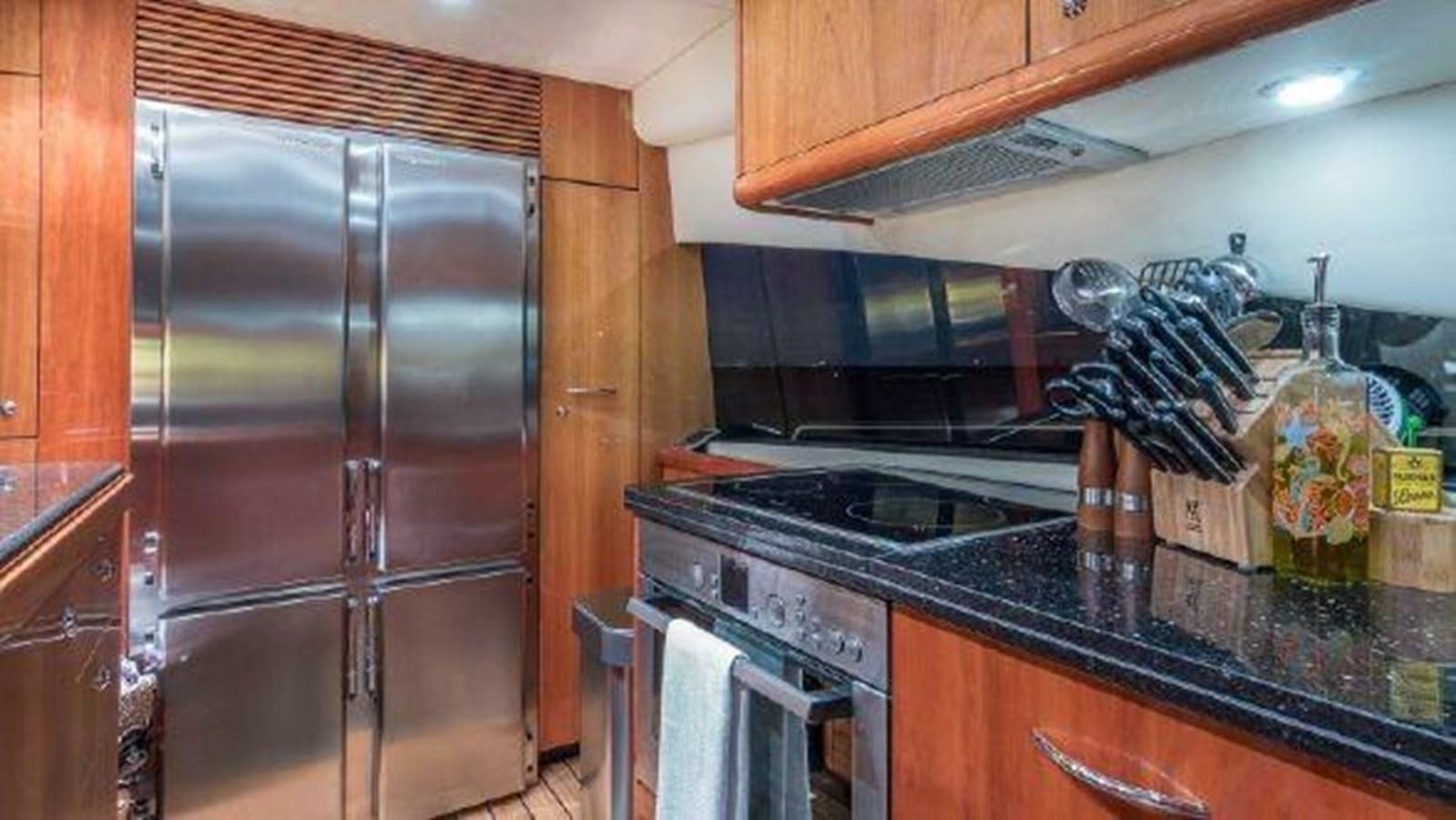 a kitchen with stainless steel appliances aboard ACQUA ALBERTI Yacht for Sale