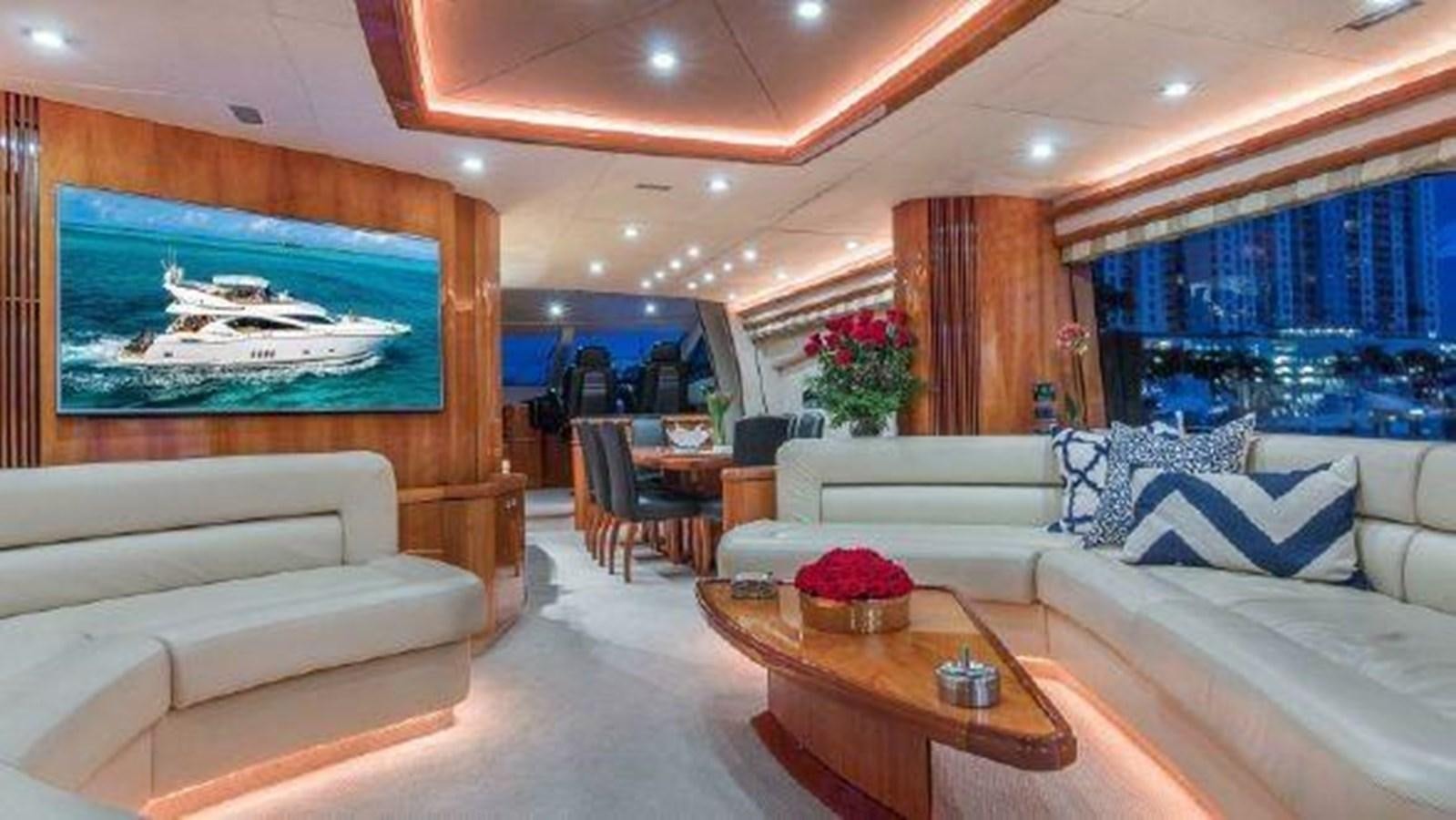 a living room with a large screen aboard ACQUA ALBERTI Yacht for Sale