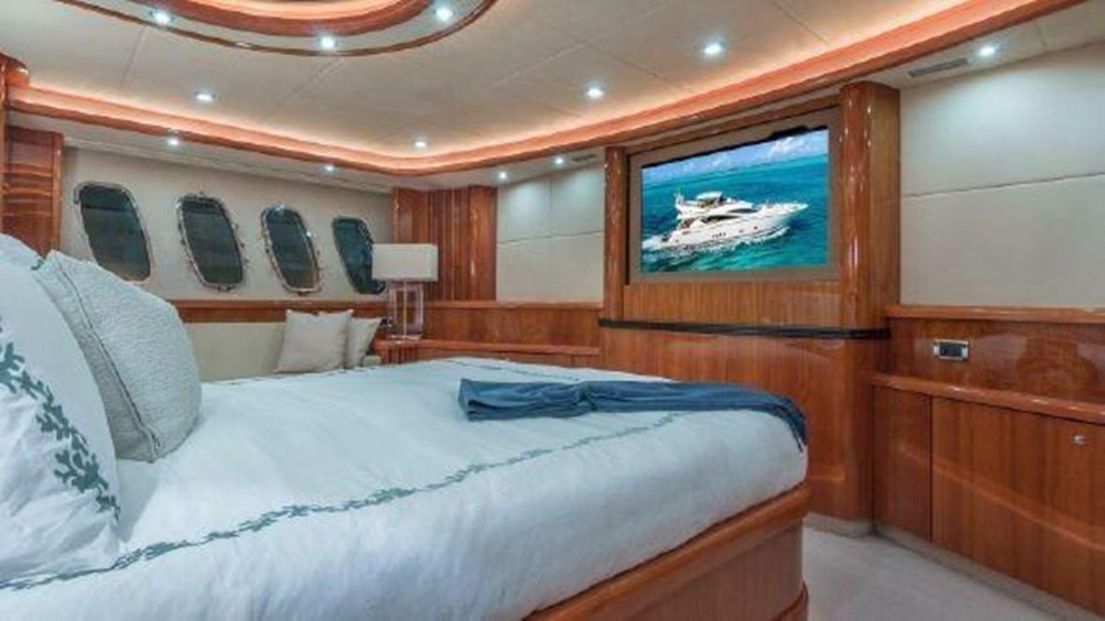 a bed with a painting on the wall aboard ACQUA ALBERTI Yacht for Sale