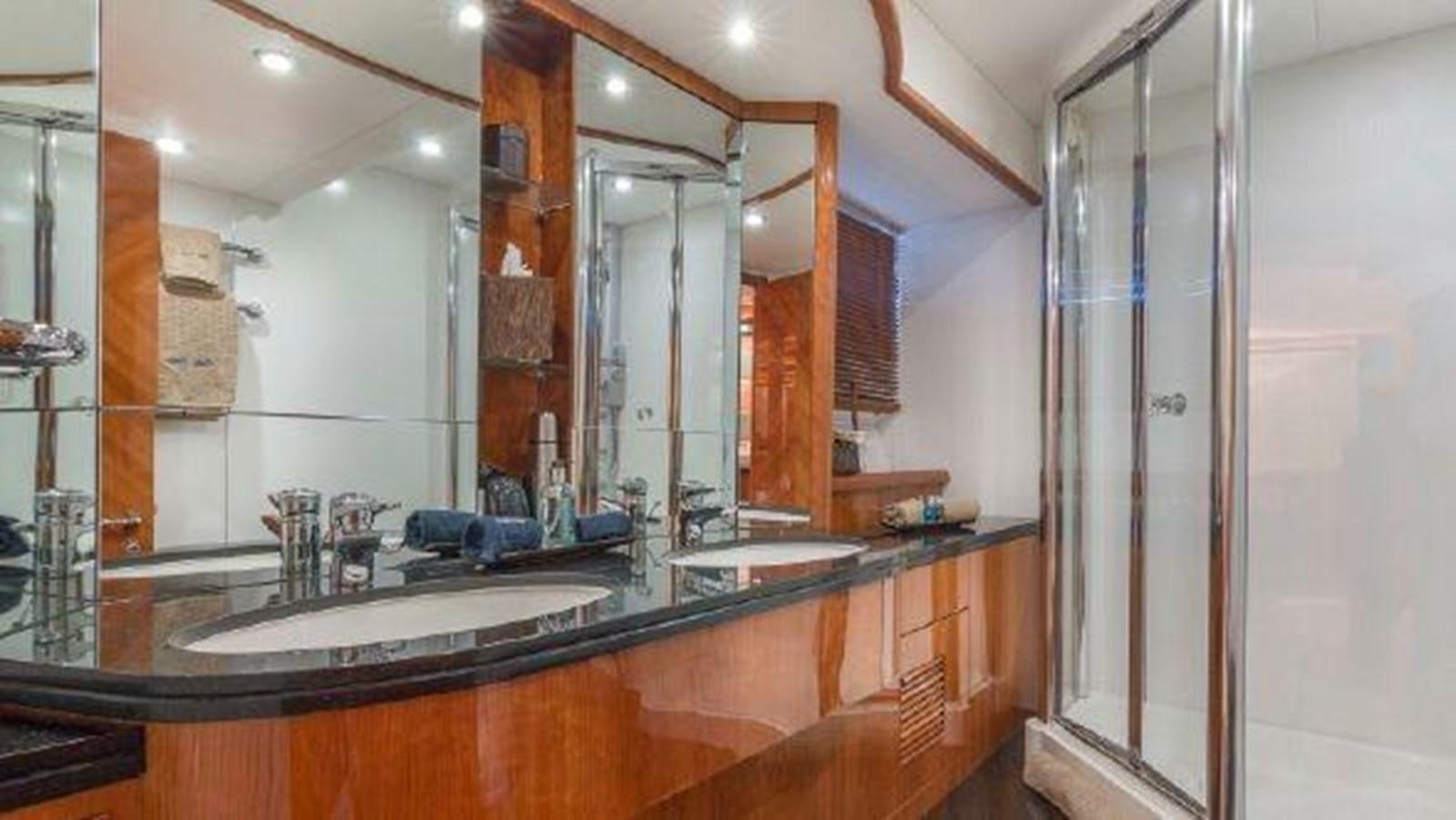 a bathroom with a large mirror aboard ACQUA ALBERTI Yacht for Sale