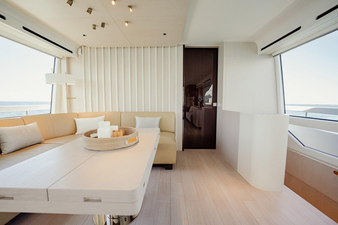 a room with a bed and a table aboard TRANSCENDENCE Yacht for Sale