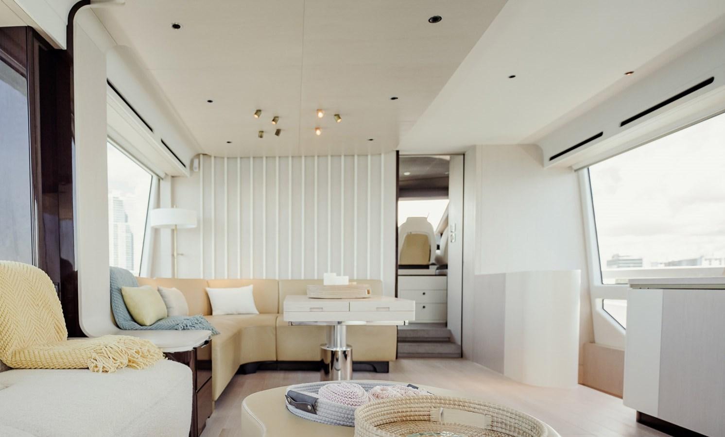a living room with a couch and a table aboard TRANSCENDENCE Yacht for Sale
