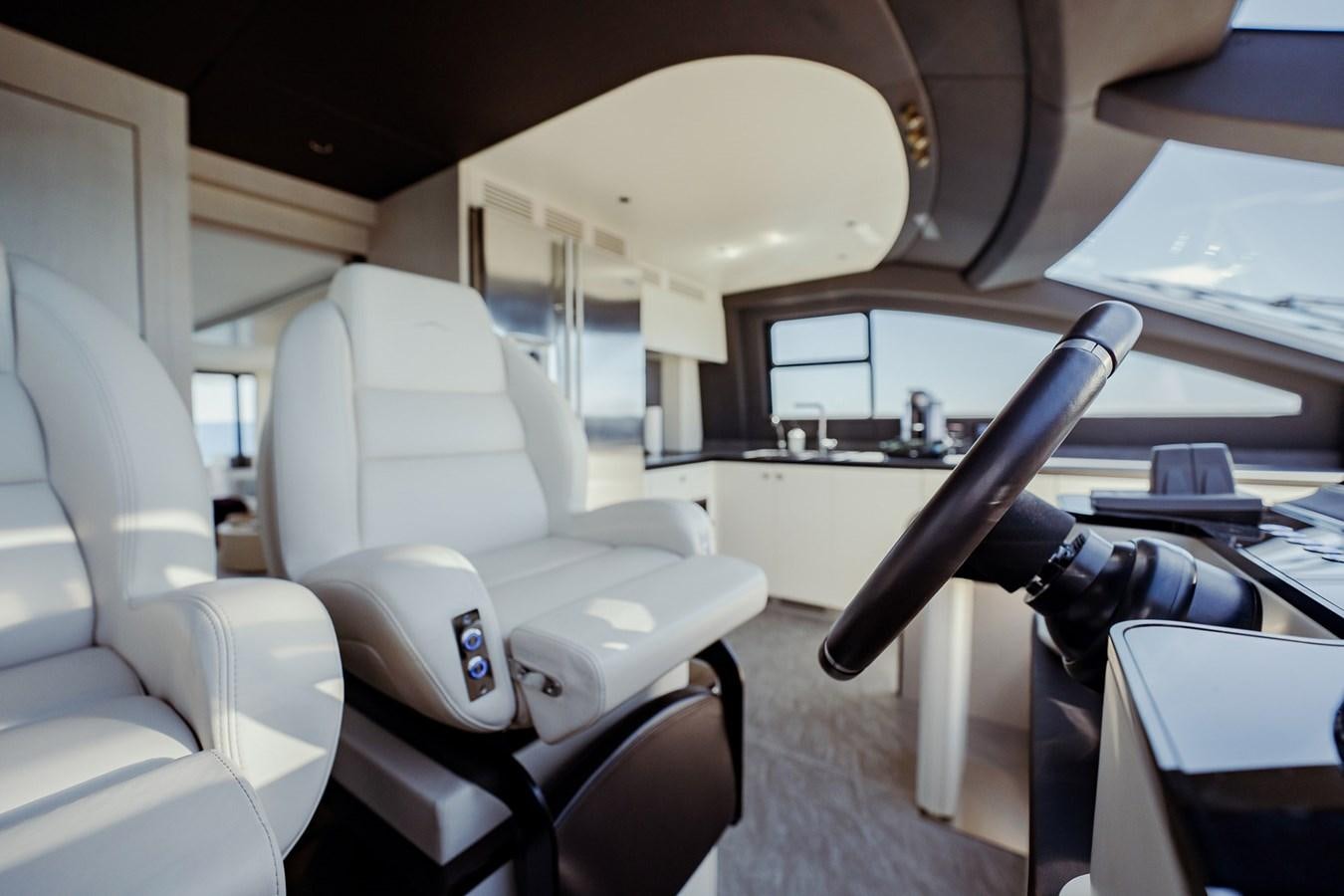 a plane with seats and desks aboard TRANSCENDENCE Yacht for Sale