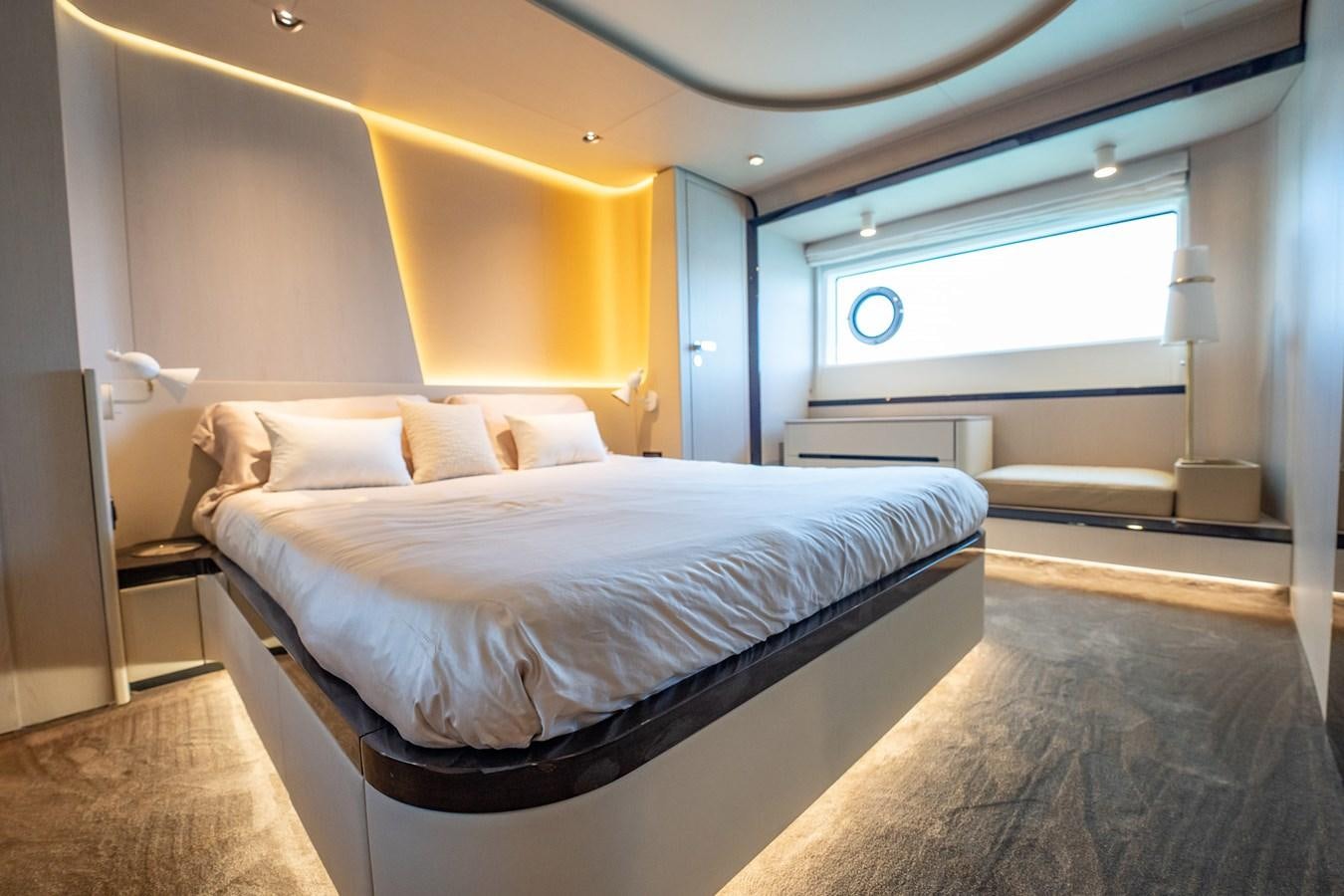 a bedroom with a bed aboard TRANSCENDENCE Yacht for Sale