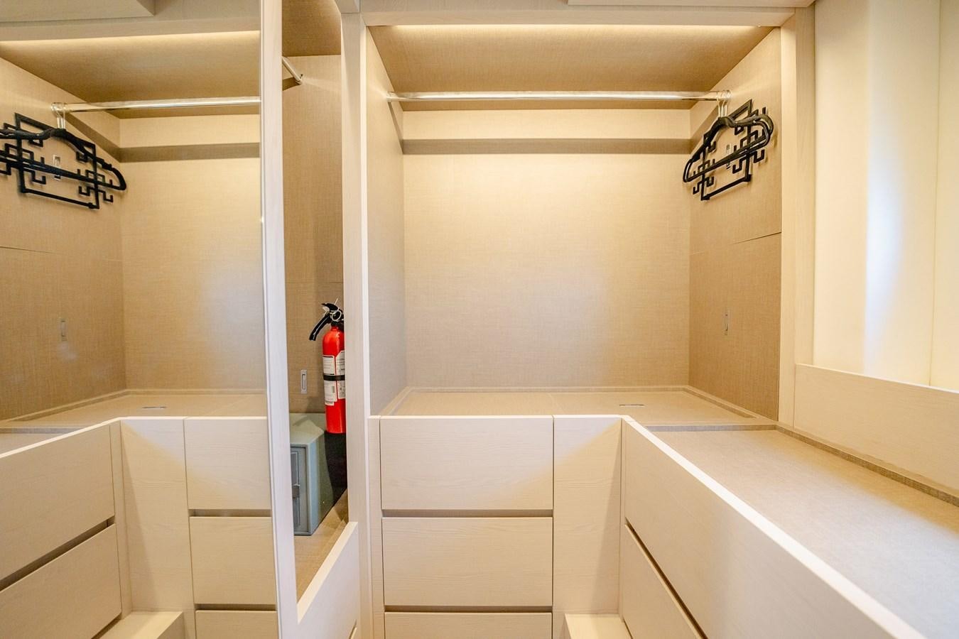 a white room with white cabinets aboard TRANSCENDENCE Yacht for Sale