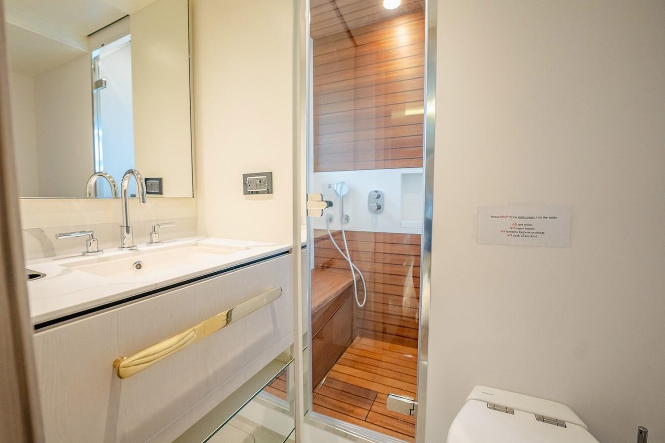 a bathroom with a sink and a mirror aboard TRANSCENDENCE Yacht for Sale