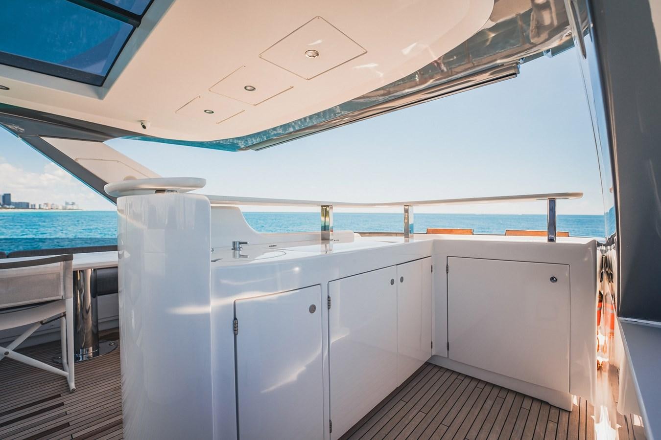 a room with white cabinets and a large window aboard TRANSCENDENCE Yacht for Sale