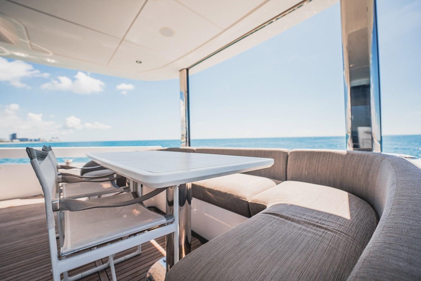 a table and chairs on a boat aboard TRANSCENDENCE Yacht for Sale