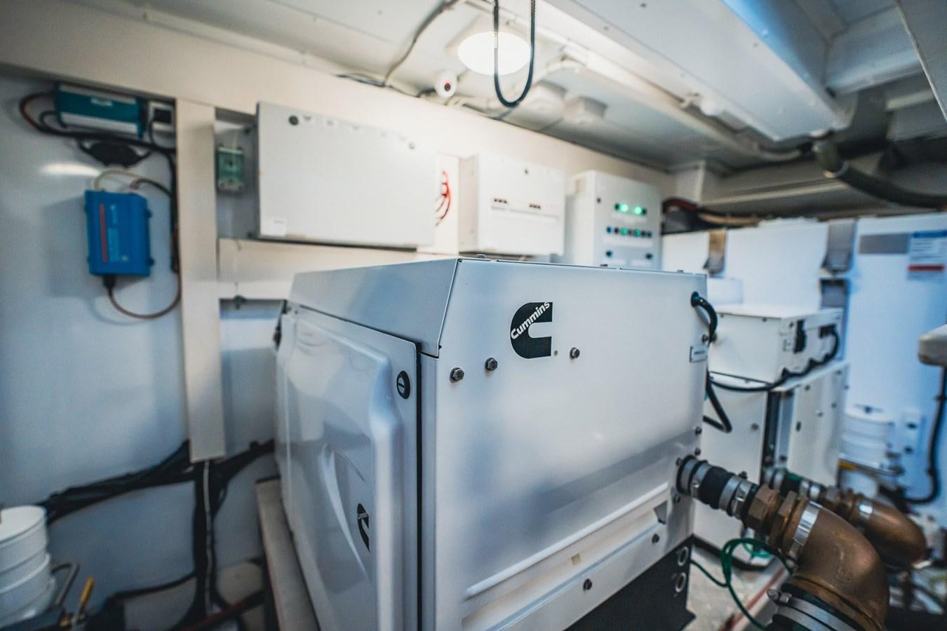 a machine with a large piece of equipment in it aboard TRANSCENDENCE Yacht for Sale