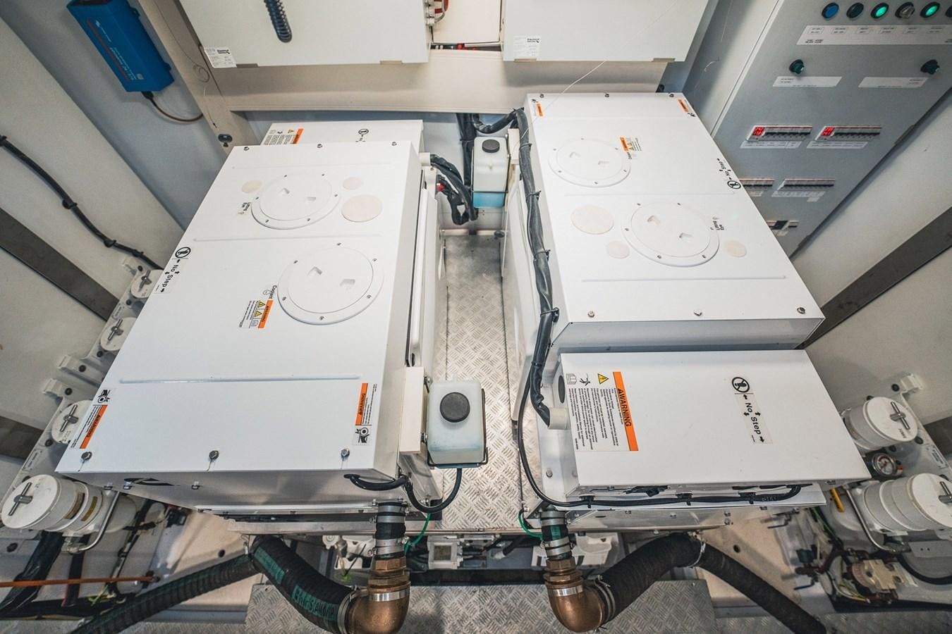 a machine with wires and a white box aboard TRANSCENDENCE Yacht for Sale