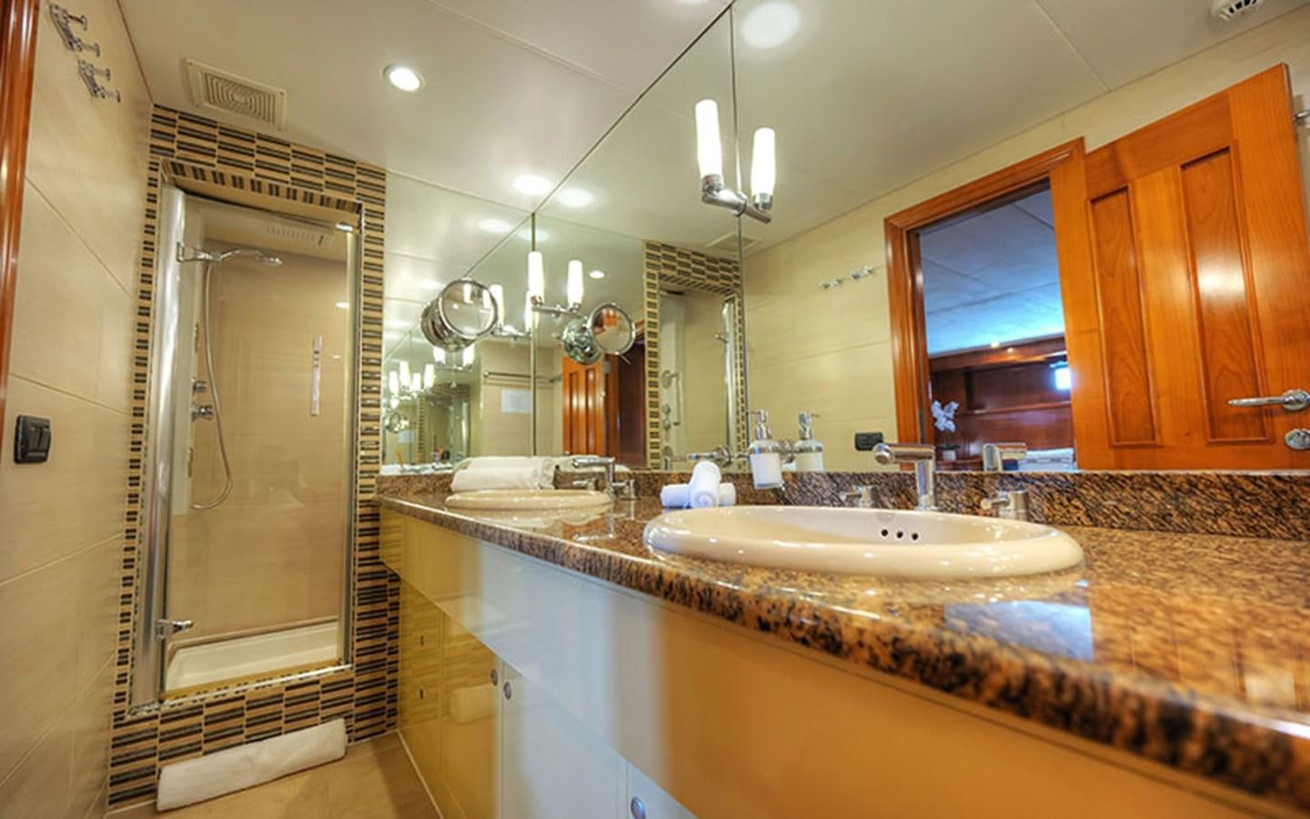 a bathroom with a large countertop aboard VOYAGER Yacht for Sale
