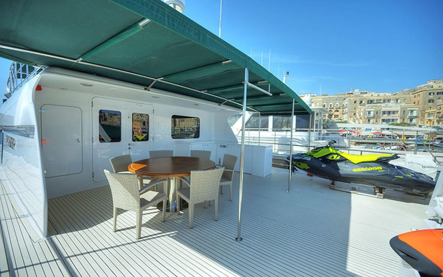 a boat on a deck aboard VOYAGER Yacht for Sale