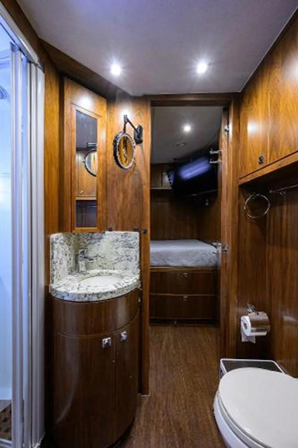 a bathroom with a sink and toilet aboard SECOND AMENDMENT Yacht for Sale