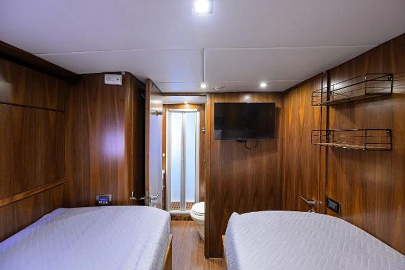 a couple of beds in a wooden room aboard SECOND AMENDMENT Yacht for Sale
