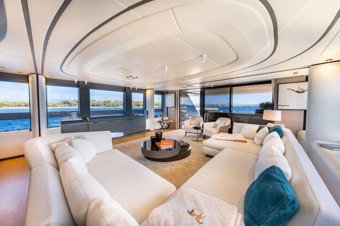 a living room with a large window aboard MY UILIA Yacht for Sale