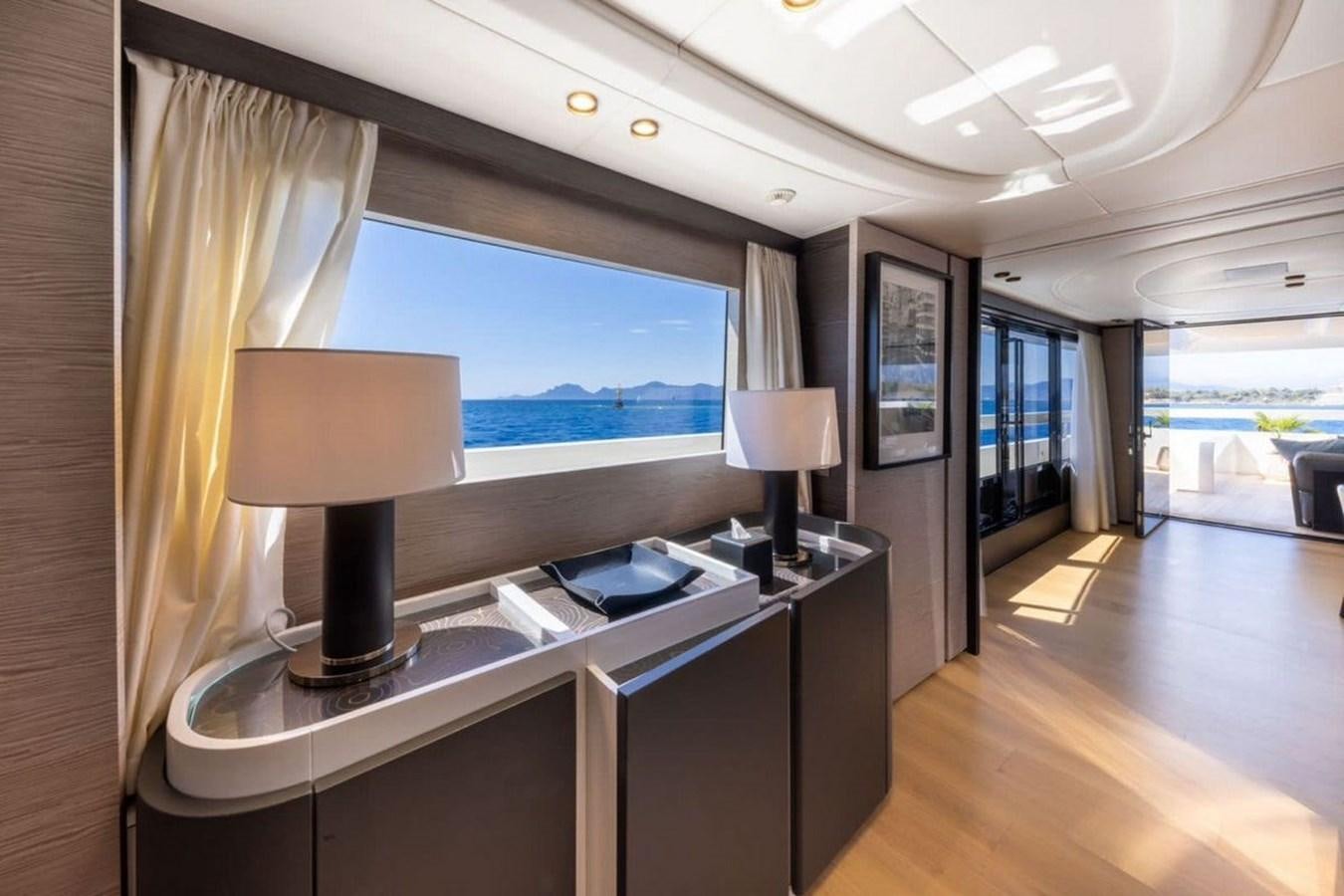 a room with a desk and a lamp aboard MY UILIA Yacht for Sale