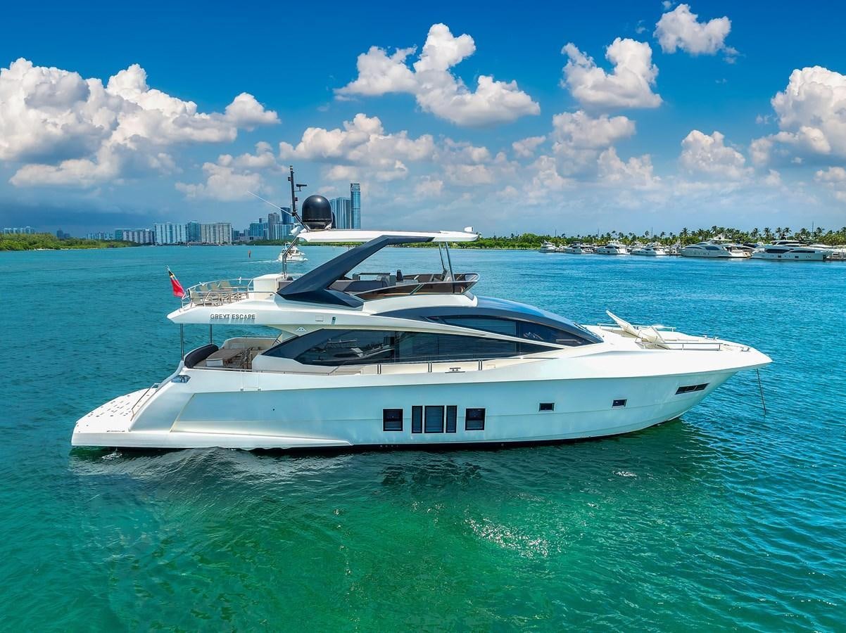 a white yacht in the water aboard GREYT ESCAPE Yacht for Sale