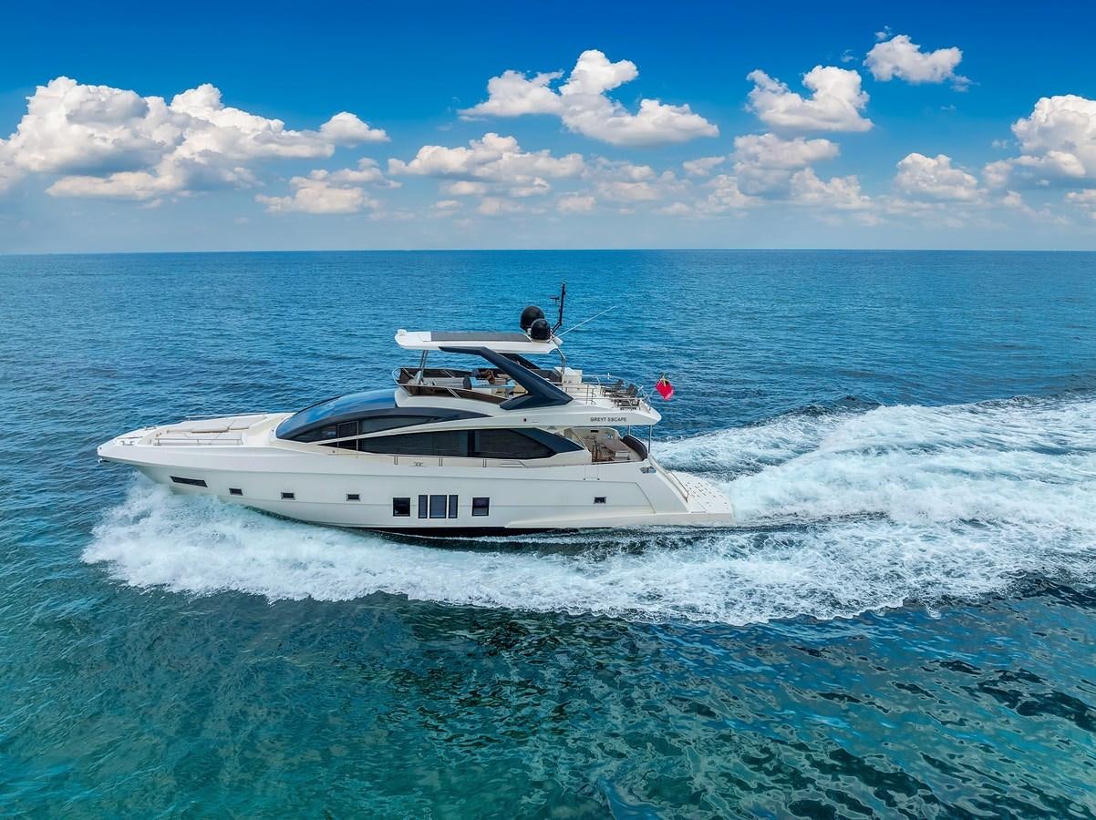 a white boat in the water aboard GREYT ESCAPE Yacht for Sale